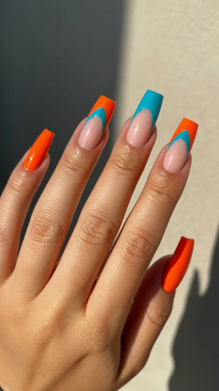 modern minimalist spring nails 2026 Bold Color Block French Tip With Orange And Blue