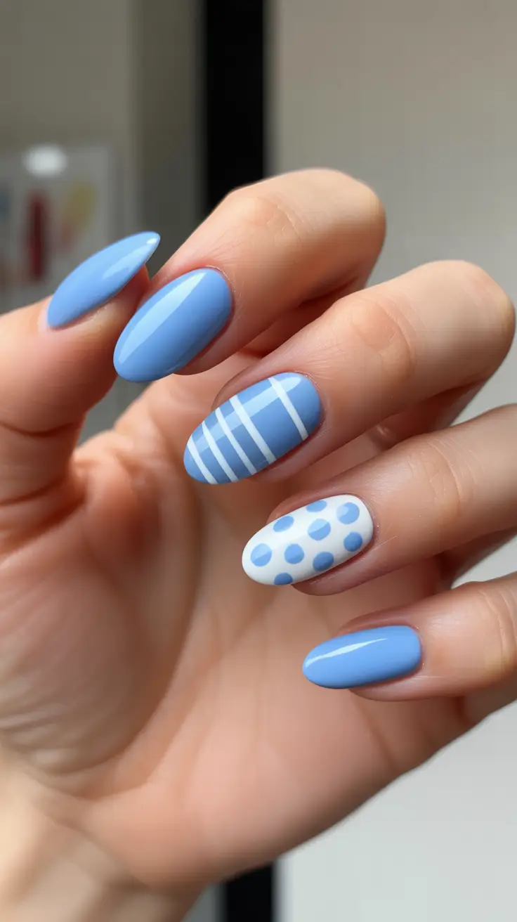 best easy spring nail designs 2026 Sky Blue Almond Nails With Stripes And Polka Accents